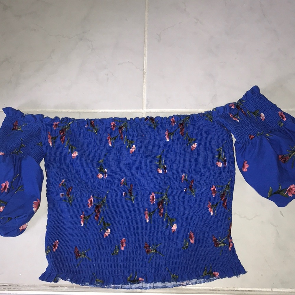 A very cute blue crop top off the shoulder shirt!